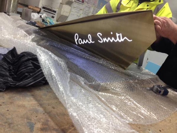 Bespoke Illuminated Brass Signs Paul Smith Workshop Stage Preparing for delivery